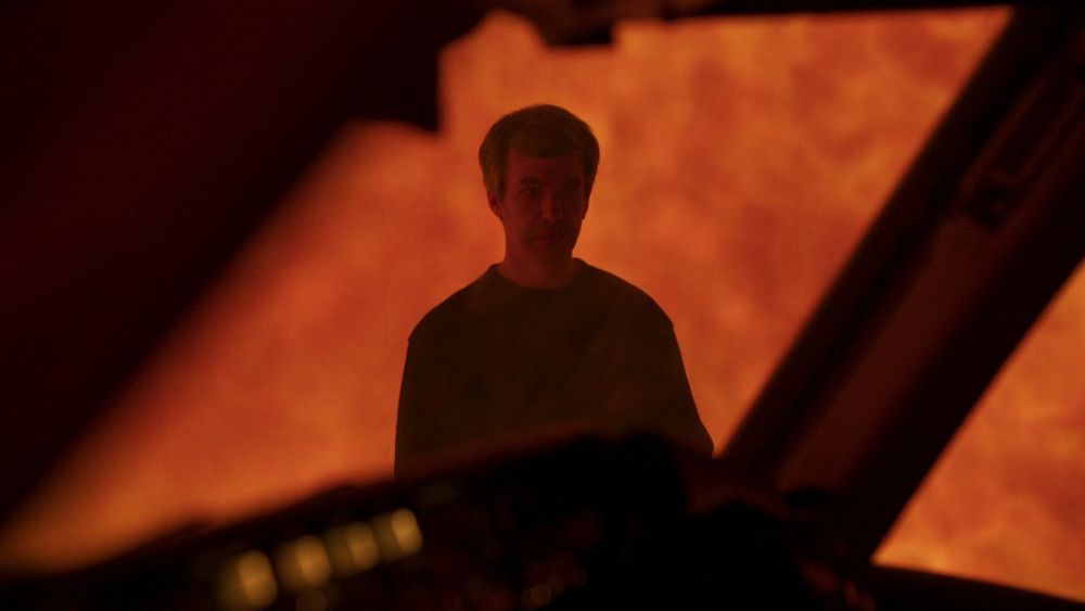 POV: nathan fielder watches you from a blazing inferno