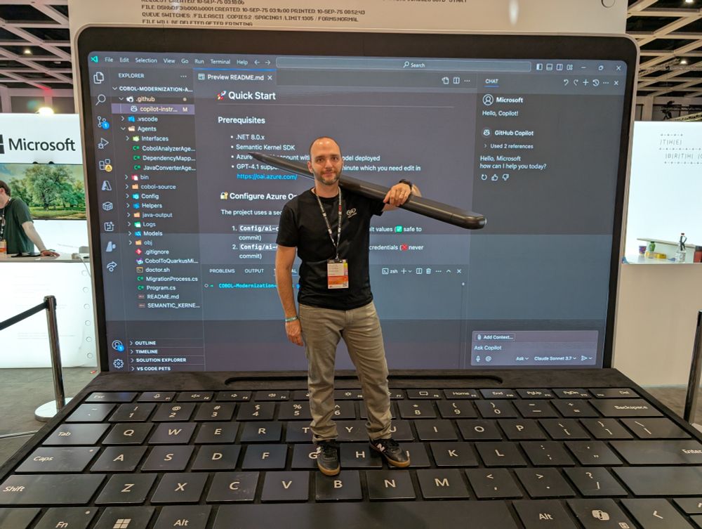 mockoon's founder photo with a giant stylus on a giant computer 