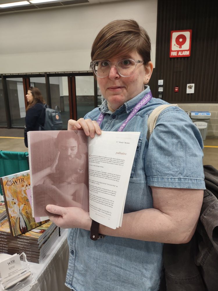 Meaks holds west trade review flipped open to their essay "palliative" 