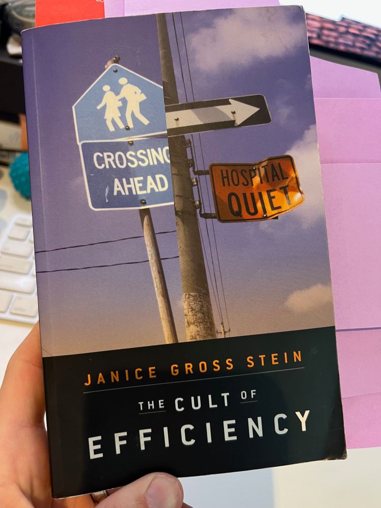 Picture of a book cover showing street signs. The book is the Cult of Efficiency by Janice Gross Stein
