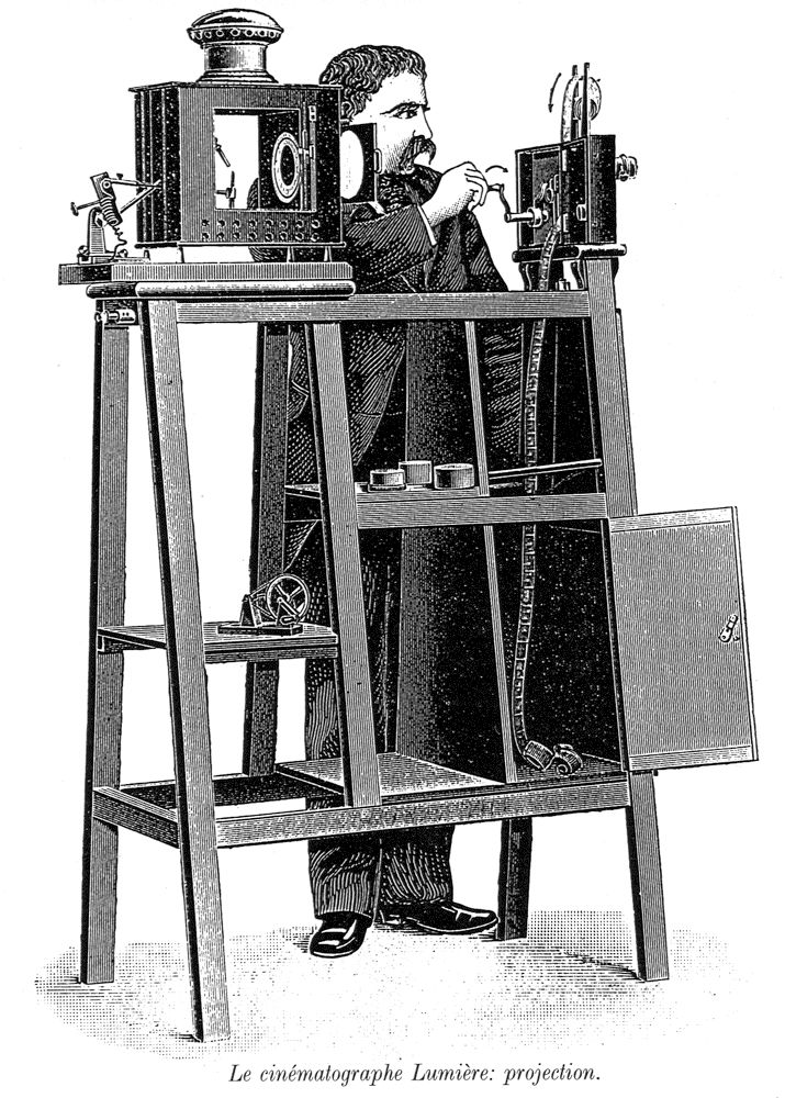 The Lumiere projector, featuring a strip of film hand wound past a projector lens