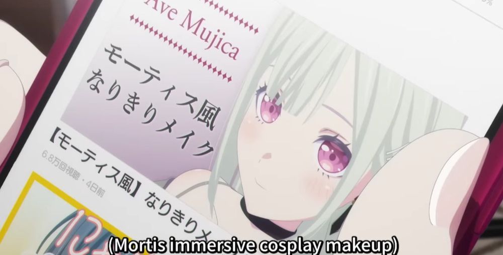 Screenshot from Ave Mujica. A video thumbnail with Nyamu dressed as Mutsumi. Video title reads "Mortis immersive cosplay makeup"