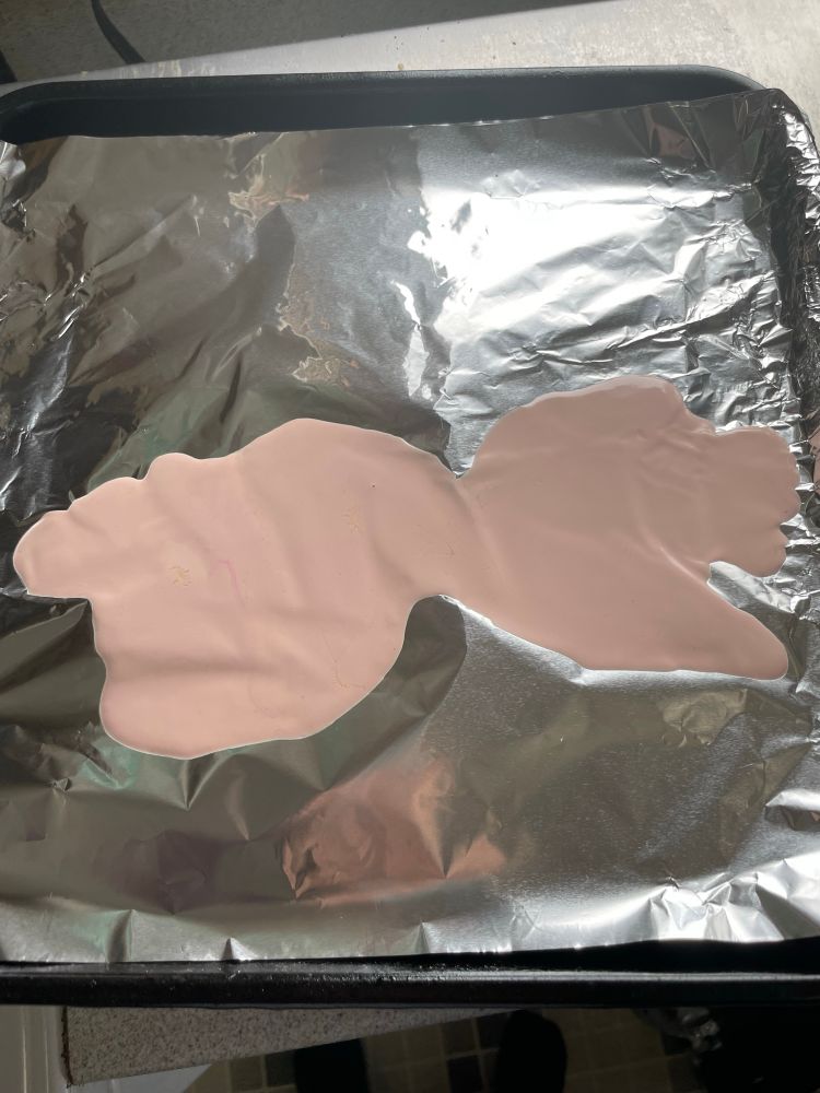 A melted puddle of what was one a molded clay sculpture 