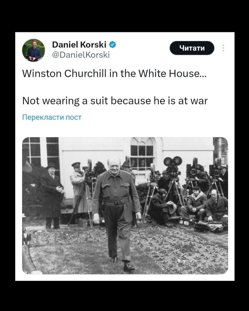 Photo of Winston Churchill wearing military shirt and pants.