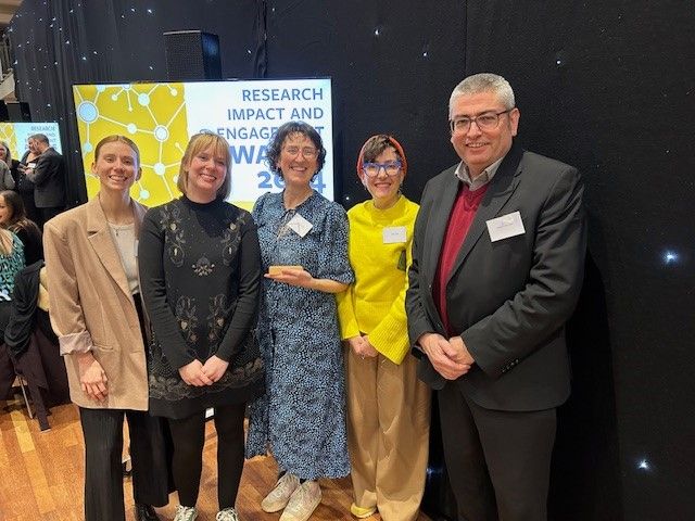 The Changing the Story team pose for a photo at the Research Impact and Engagement Awards, University of Leeds