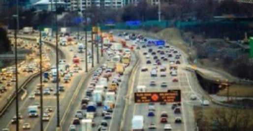 Highway willed with choked lanes of traffic 