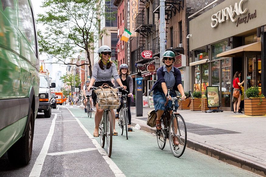People riding in a separated bike-lane