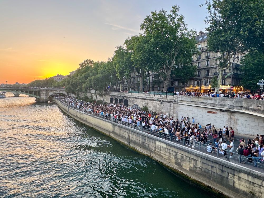 Thousands of people on the edge of the Seine in Paris.