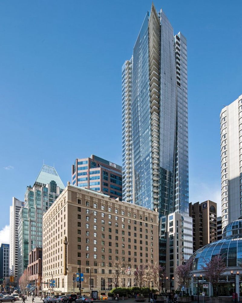 The historic Hotel Georgia in downtown Vancouver, with a tall residential tower beside it that paid for the restoration of the historic hotel with bonus density. Without this program, the heritage hotel would likely not still exist.
