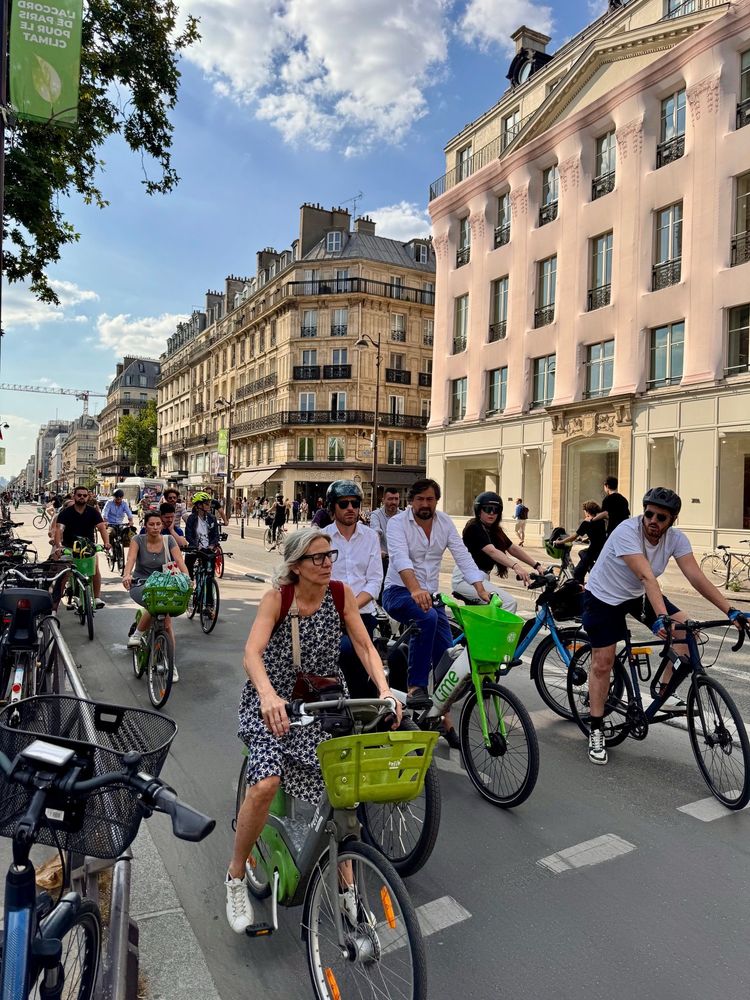Bike lane in central Paris filled with people on bikes moving smoothly and efficiently 
