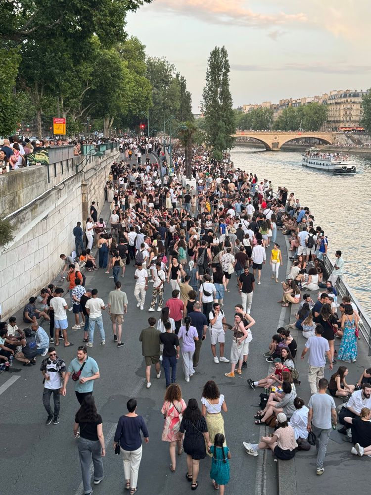Thousands of people on the edge of the Seine in Paris.