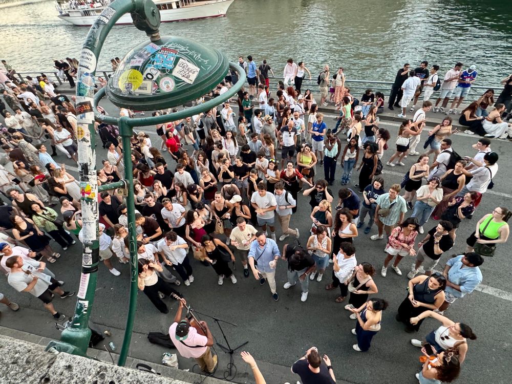 Thousands of people on the edge of the Seine in Paris.