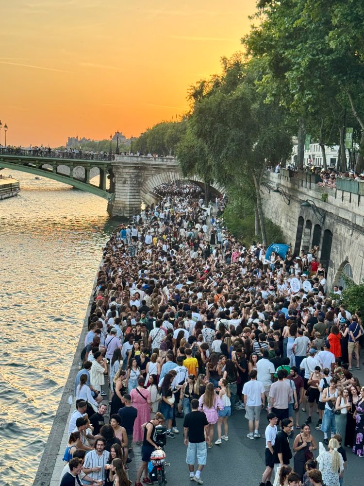 Thousands of people on the edge of the Seine in Paris.