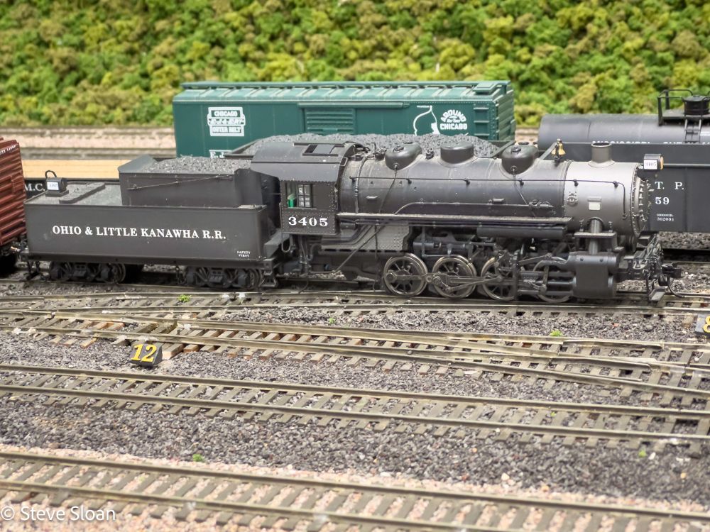 Ohio & Little Kanawha (O&LK), 0-8-0 3405. This is an HO model. There is a real shortline of that name but this O&LK was a Freelanced C&O railroad in West Virginia. This HO model railroad was in Sunnyvale, CA. This layout was owned by Master Model Railroader Ted Stephens. It was built for operations, and contained a lot of important layout design concepts that make it perfect for operations.
I only got to operate on the O&LK once, on Thursday, October 5, 2023. It was a lot of fun. O&LK 3405 was the locomotive I ran. O&LK has since been taken down.