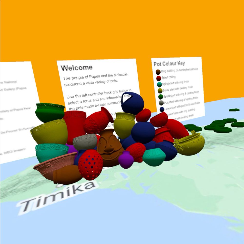Models of pots from Papua New Guinea sitting on a map