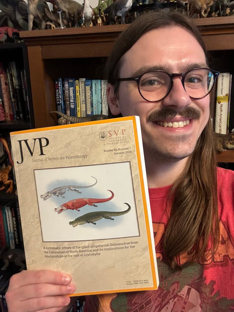 Me with my illustration of Deinosuchus on the cover of the Journal of Vertebrate Paleontology.