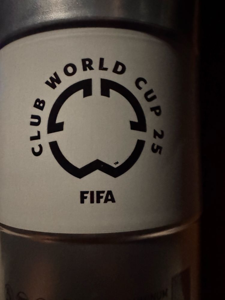 An aluminum cup with a white hammer that says club World Cup 25, fifa 
