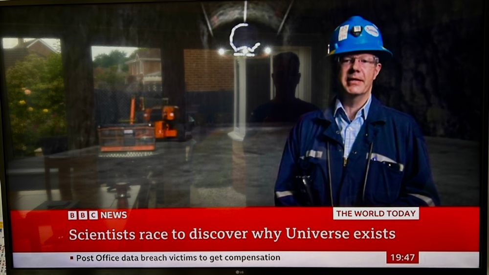 News report saying that scientists are racing to discover why the Universe exists