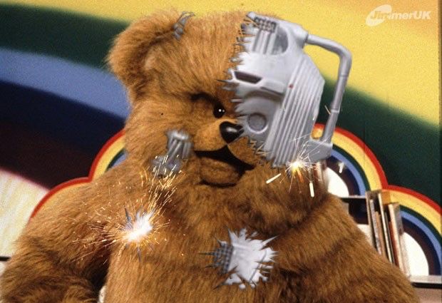 Bungle from rainbow photoshopped to look like his fur is coming off, revealing him to be a cyberman. 