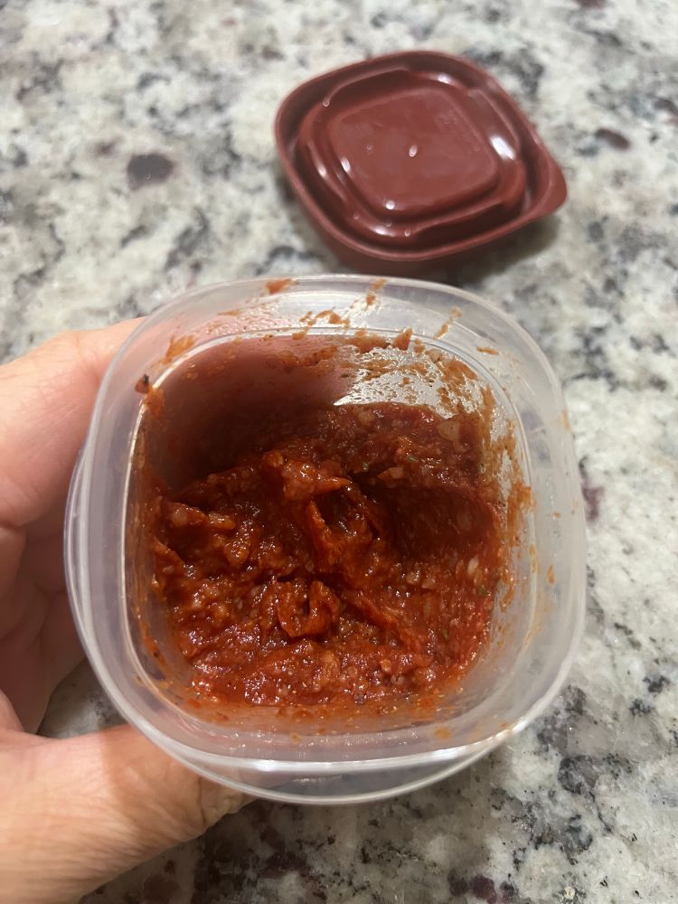 Small plastic container with amakaze ketchup. Tomato paste and amakaze in equal proportions, big shake of powder garlic and paprika, little dashes of cloves, all spice, chili powder, black pepper, oregano

Left it in the fridge for two days for the enzymes to do their work