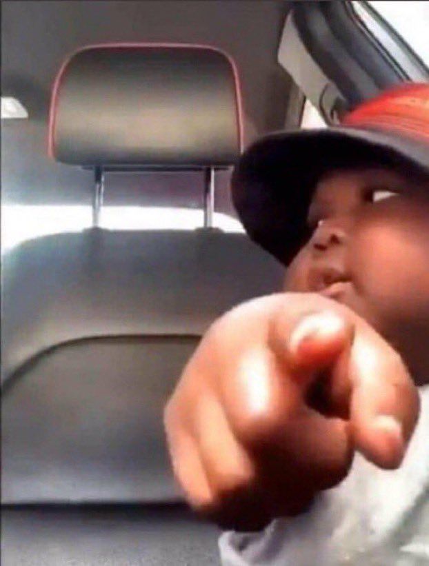 little boy pointing at camera
