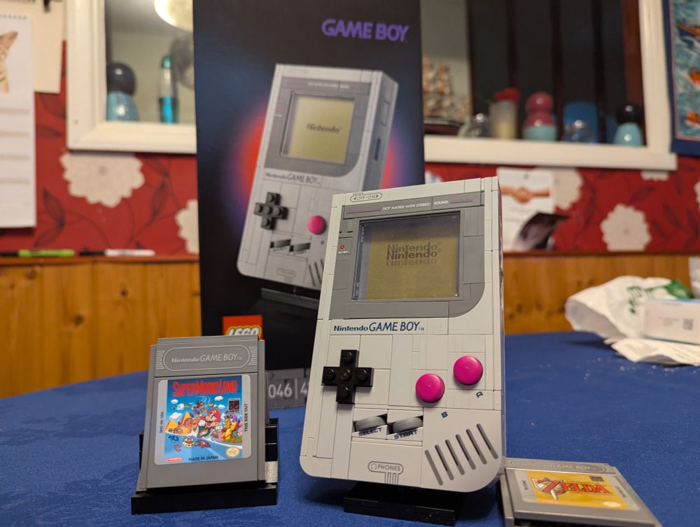 The completed Game Boy LEGO set on a table in front of the box. 