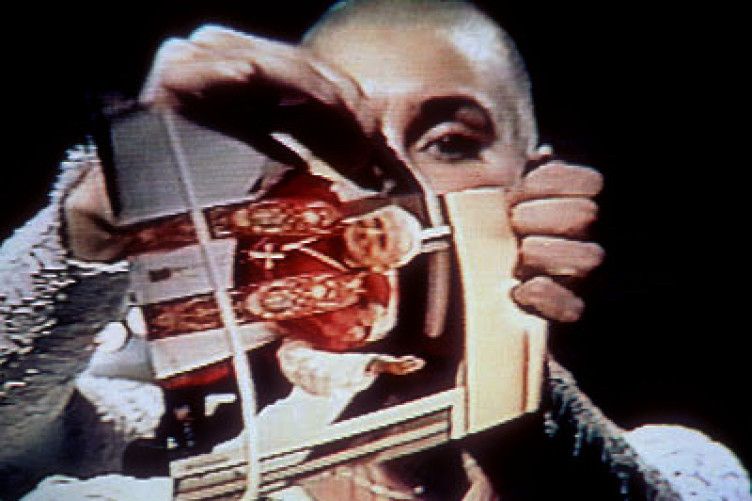 Sinead O'Connor ripping up a photo of the pope