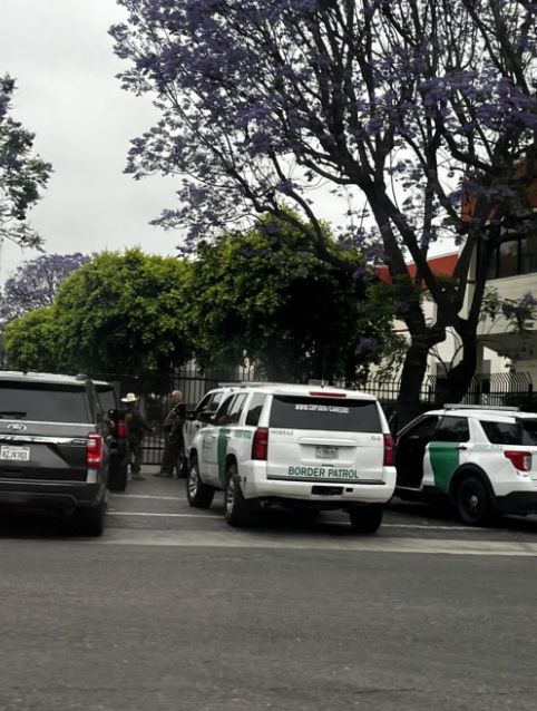 Multiple Border Patrol vehicles and an unmarked black SUV outside the Home Depot in Paramount