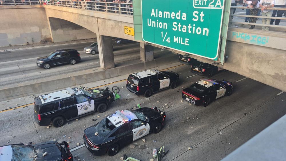 A bunch of CHP cop cars on the 101 freeway absolutely destroyed by large chunks of concrete and Lime scooters thrown from above
