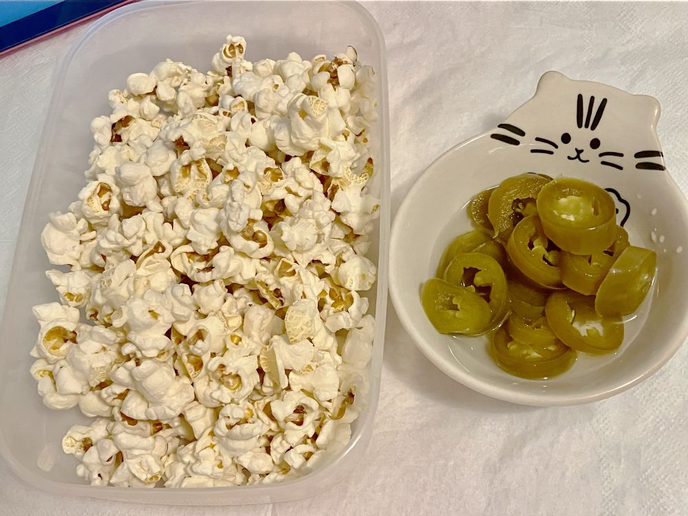 popcorn and pickled jalapeño peppers served in bowls
