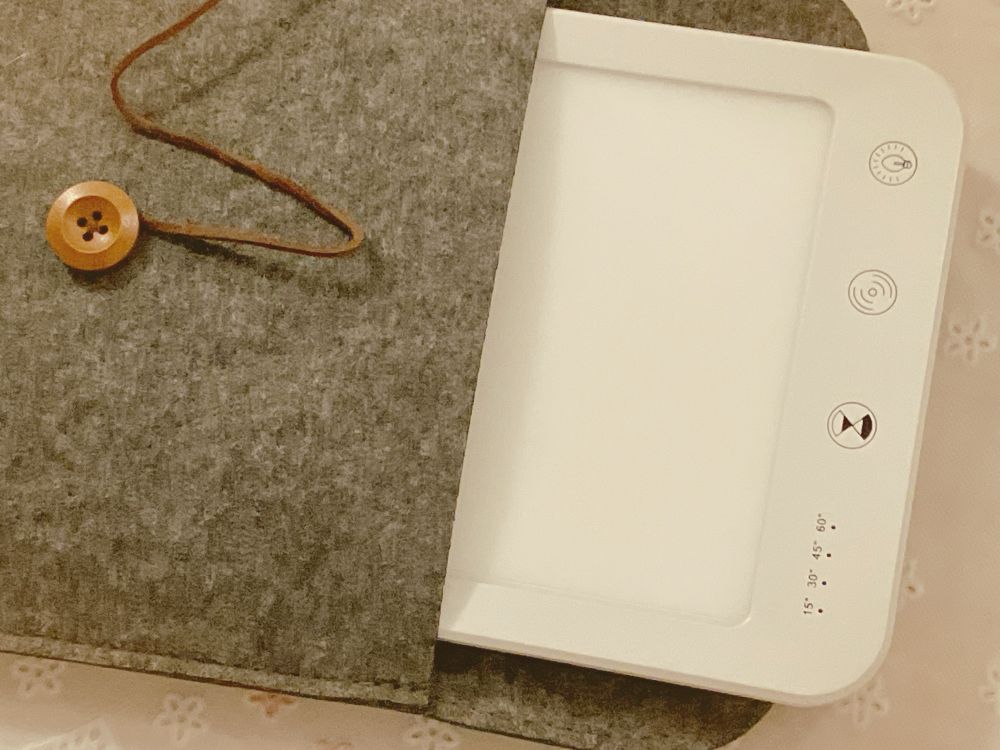 happy light lamp half-taken out of its protective case