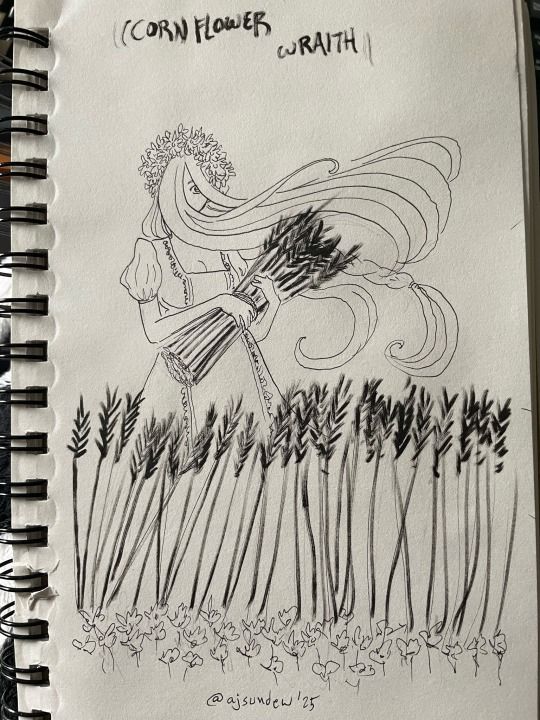 A woman stands in a field of wheat, the foreground blanketed in cornflower blossoms. She is holding a bundle of wheat in her arms, while her long blonde hair blusters about in the wind. Only one of her eyes is visible. She also wears a crown of cornflowers. Text reads "Cornflower Wraith," with signature @ajsundew '25