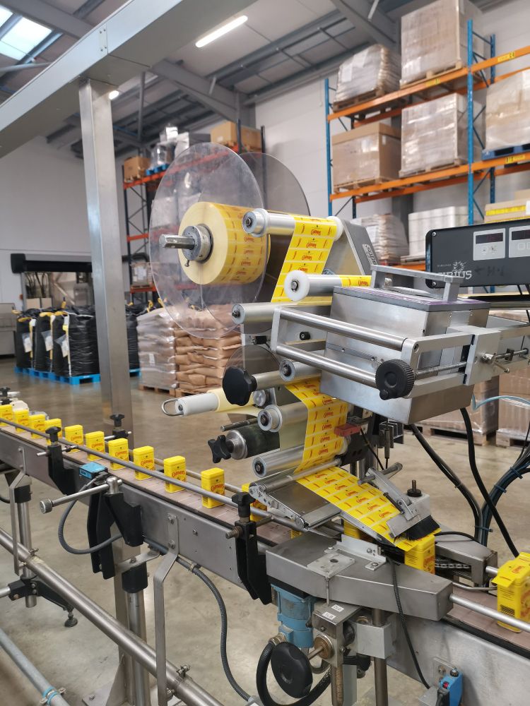 Freshly packaged, locally grown Colman's mustard on the production line at Condimentum