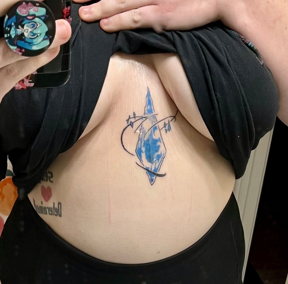 Morror Photo of blue crystal tattoo