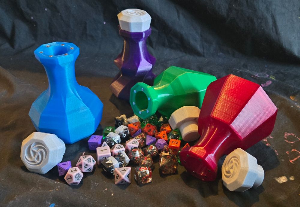 Four bottles placed with several dice sets