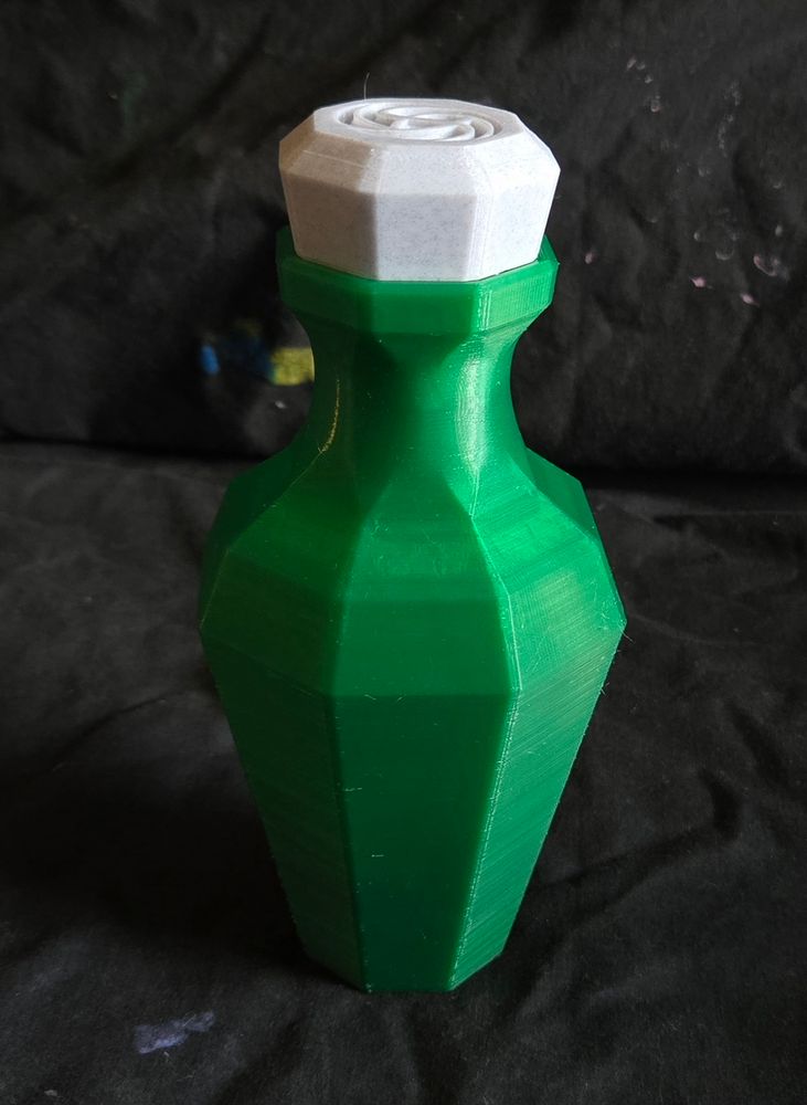 Green bottle with white lid