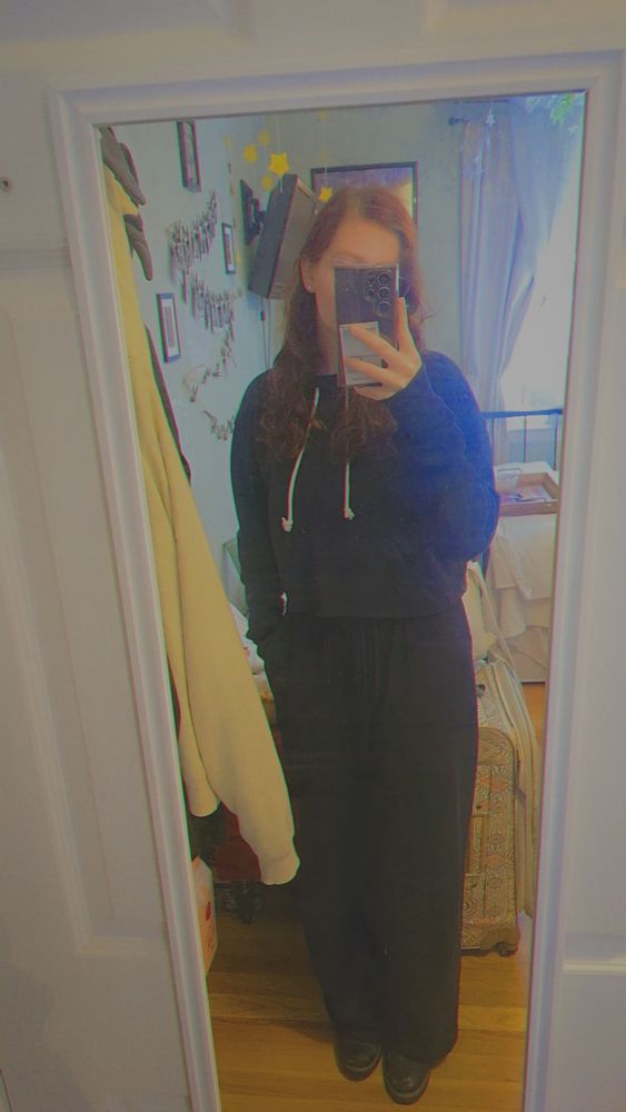 Me in a black cropped hoodie with black sweatpants