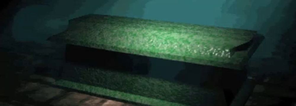 a green coffin is sitting in a dark room in the water .