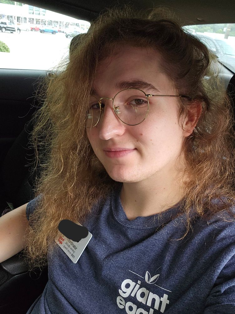 Moe sitting in her car on her break