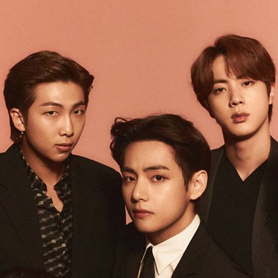 Kim NamJoon, Kim SeokJin and Kim TaeHyung of BTS  - affectionately called the "Kim Line" looking quite dapper in suits. The image is cropped from their Time Magazine shoot in 2020 when they were Entertainer of the Year.