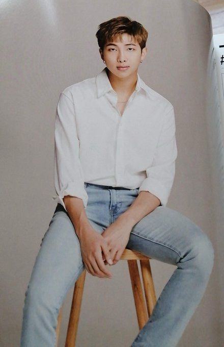 Kim Namjoon is jeans and button up shirt showing smile and beautiful dimples.