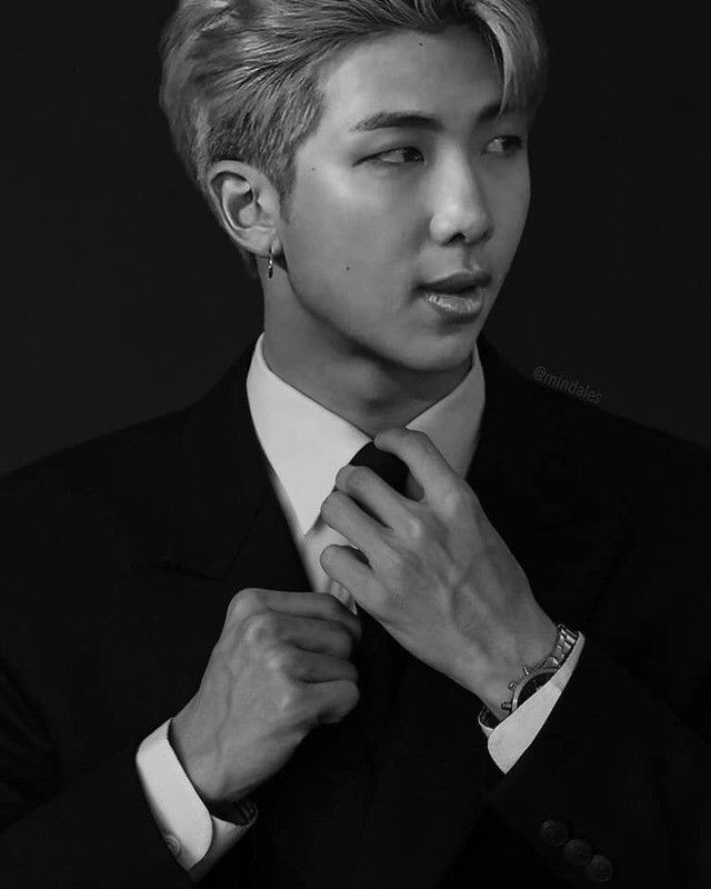 Kim Namjoon in suit and tie looking very stately