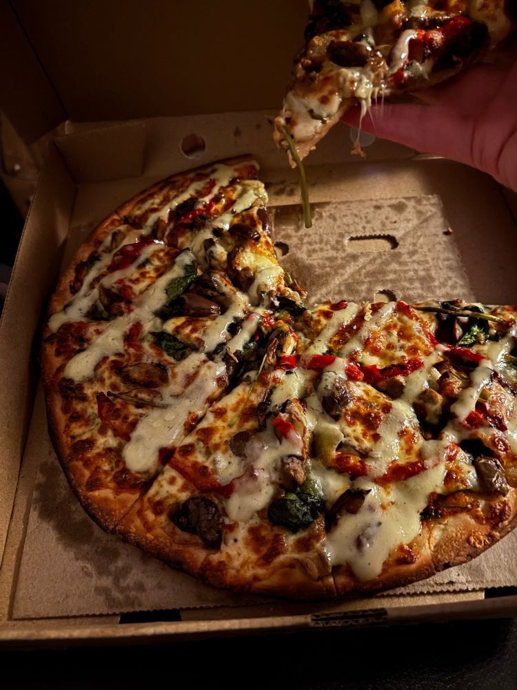 Perfect looking vegetarian supreme pizza 
