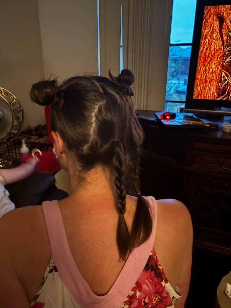 My back, hair in two side, low plaits. Two “princess laya” buns on the top 