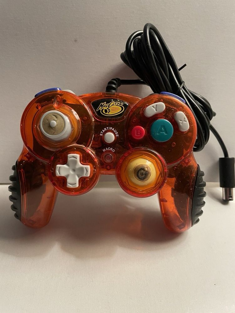 an orange mad catz gamecube controller