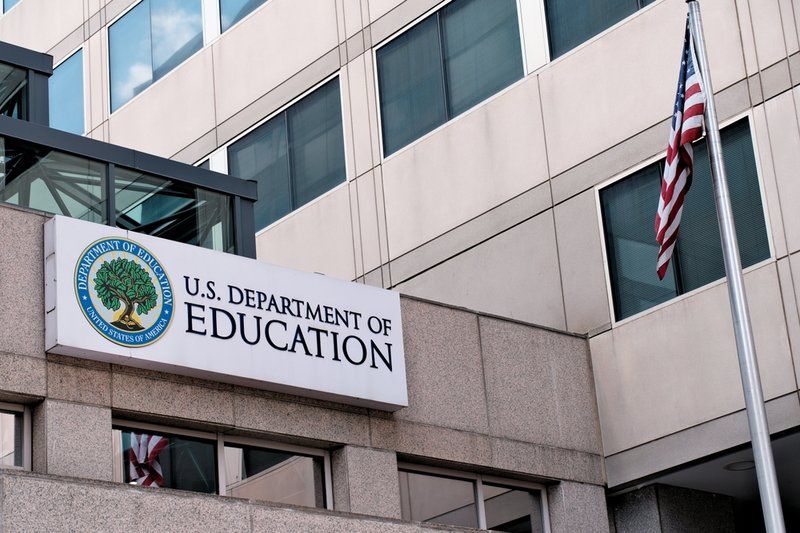 The U.S. Department of Education building and an American flag