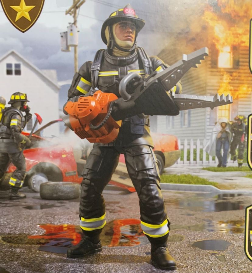 The back of box render for the GI Joe Classified Series Legacy Collection Firefighter. A firefighter in the foreground poses dramatically with the jaws of life. Another firefighter in the background sprays a wrecked car with foam. A third firefighter even further back escorts a man away from a burning house.