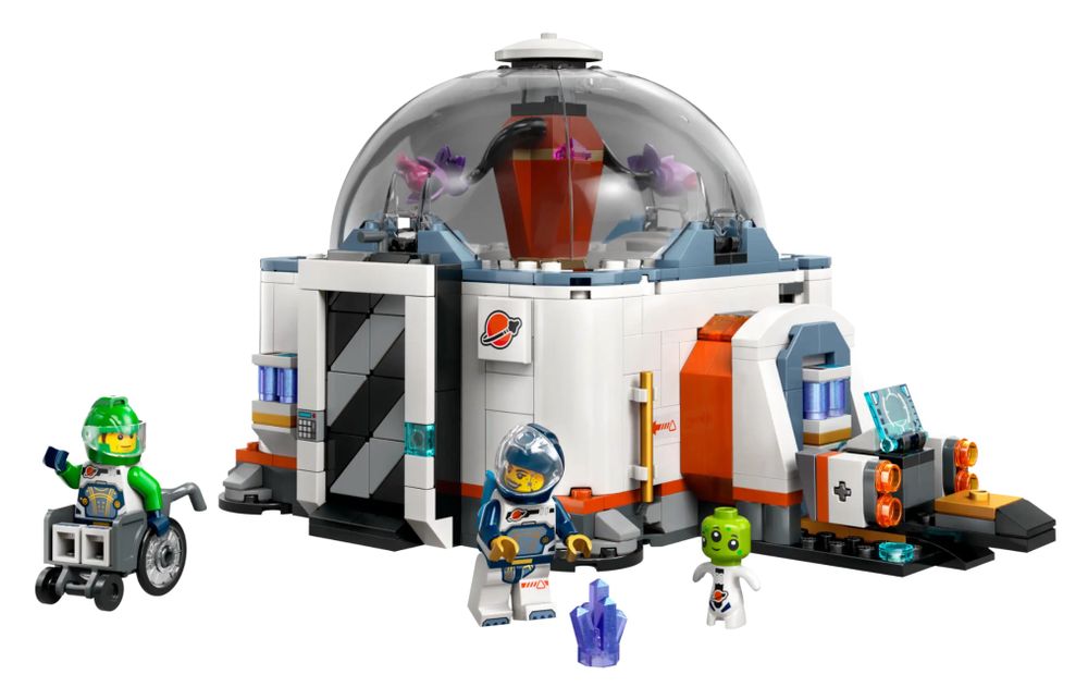 Two astronaut minifigs outside with helmets, an alien astronaut minifig without a helmet