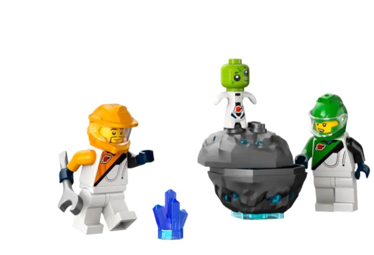 Two LEGO minifig astronauts and an alien astronaut, all wearing spacesuits, but the minifigs have helmets, the alien does not