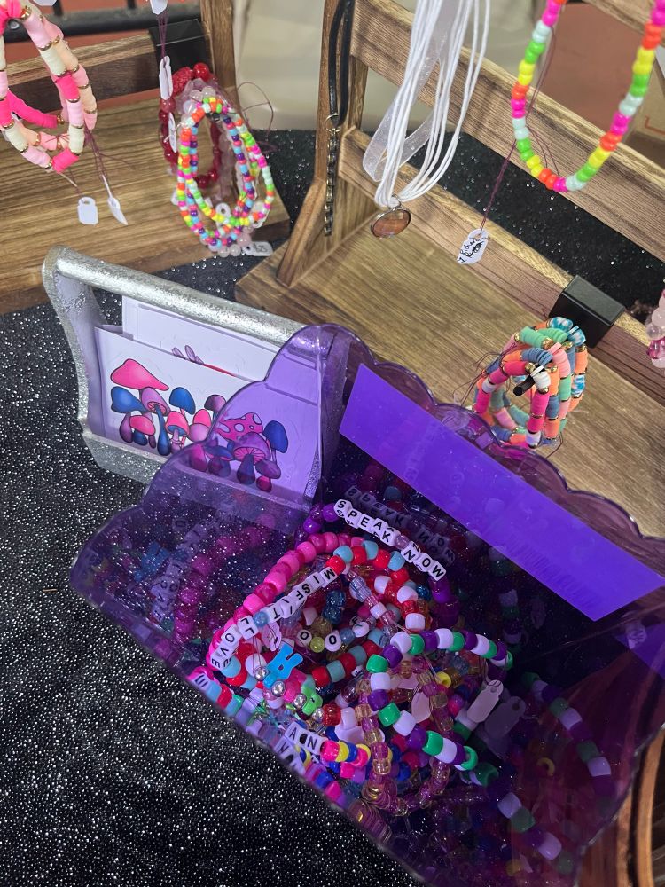 Bracelets, necklaces, stickers for sale.